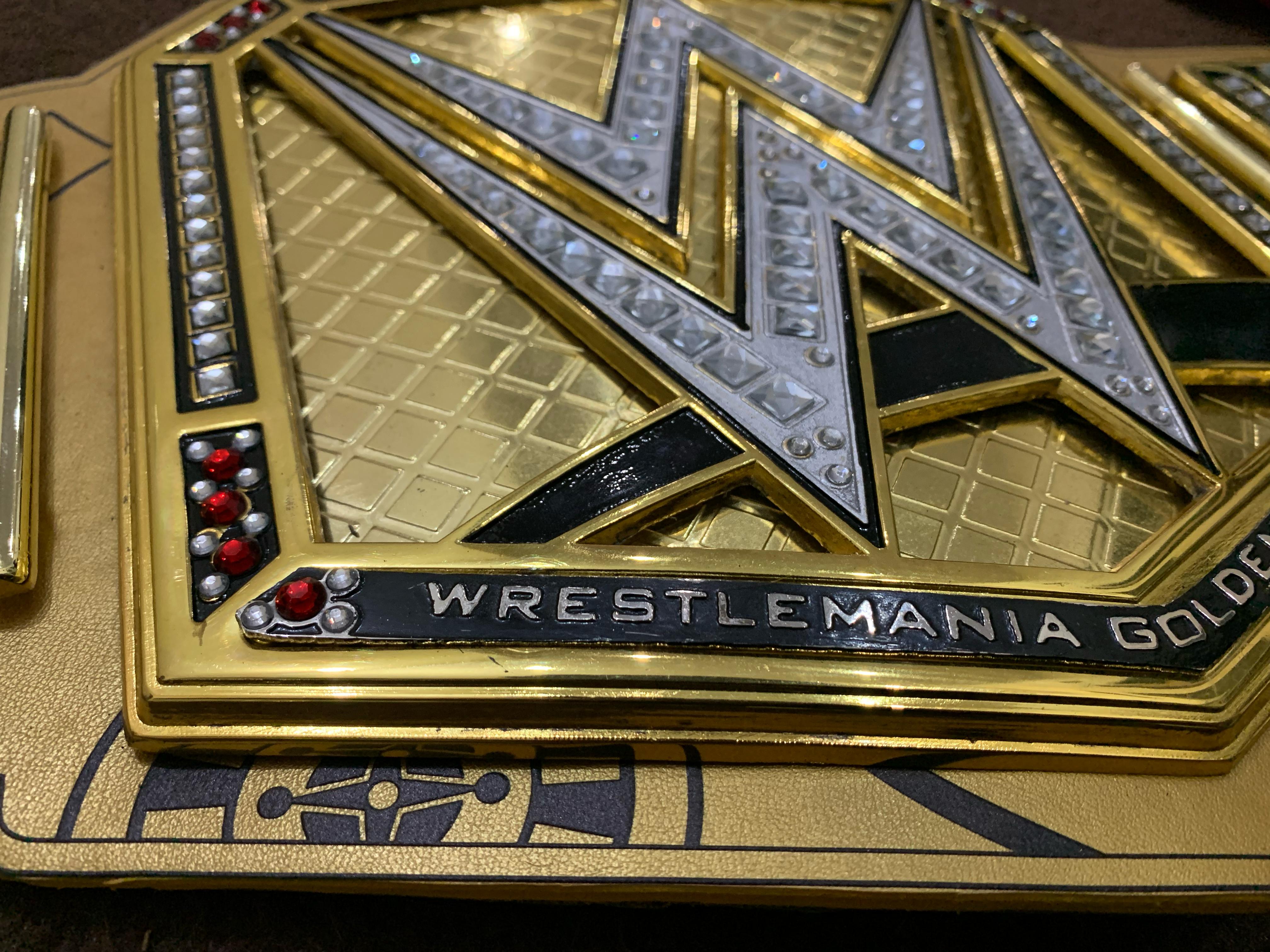 Championship belt leather strap and plates assembled — pre-finishing stage