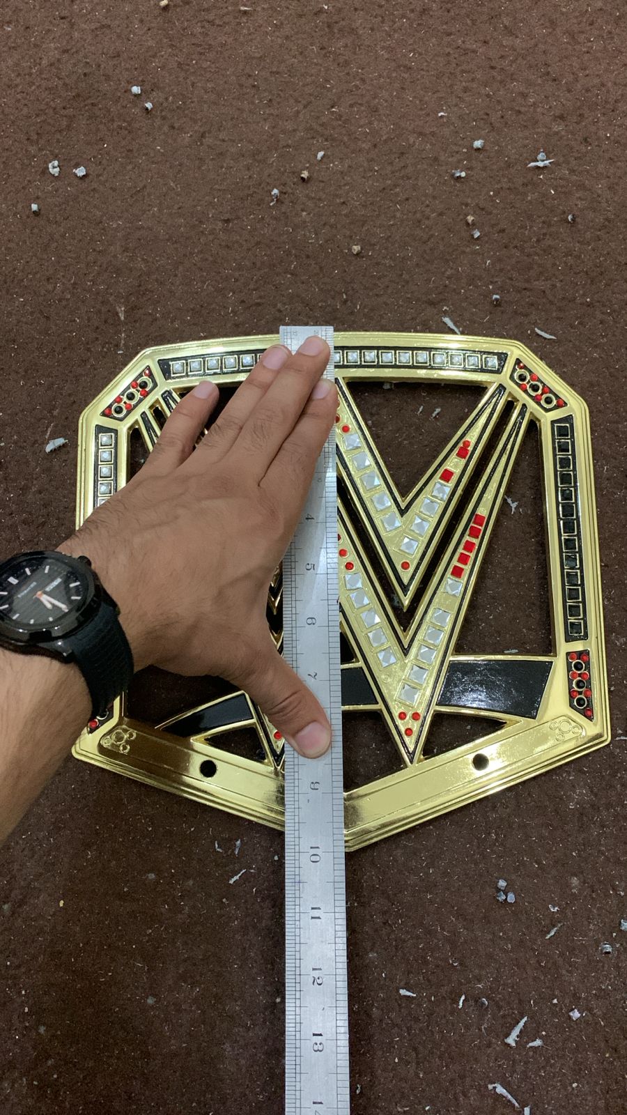 Multiple championship belt plates finished and quality-checked