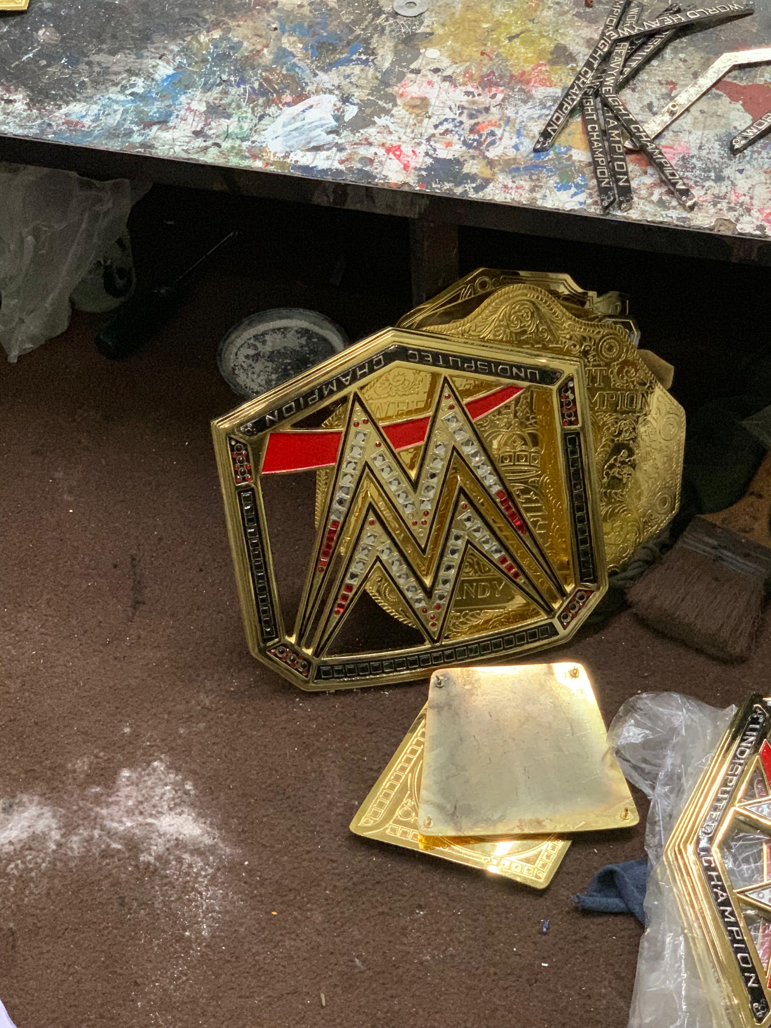 Championship belt centre plate detail — hand-polished finish
