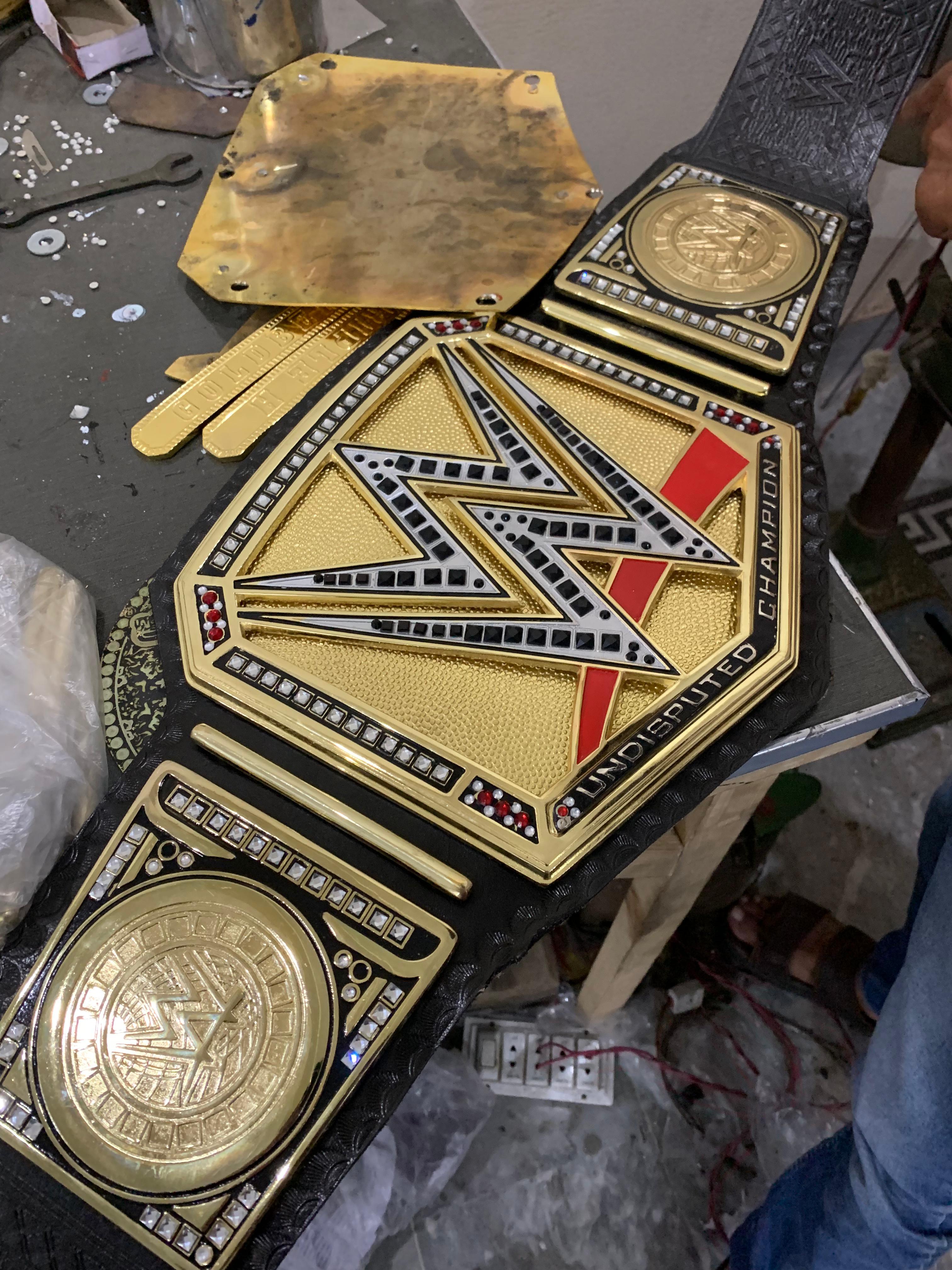 Side plate and leather strap detail on finished championship belt