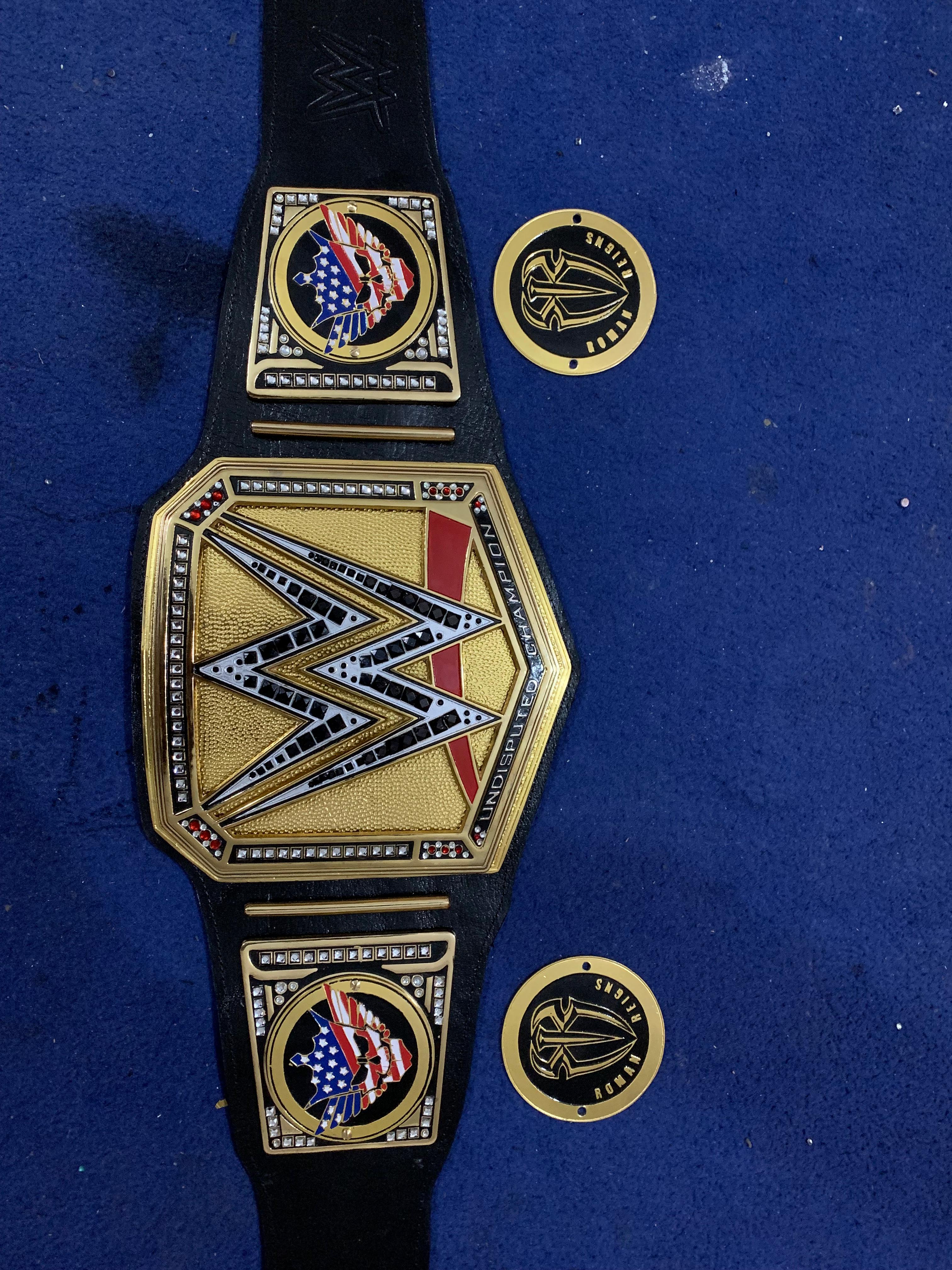 Championship belt showing detached custom sideplates